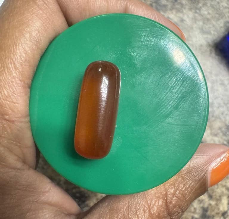 vegan-omega-3-supplement - picture of the Ovega supplment to compare size on green lid to show size